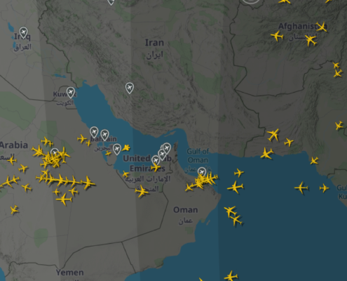 Digital air traffic tracking map showing high flight density over Saudi Arabia, the United Arab Emirates and the Gulf of Oman, with aircraft rerouted around the Strait of Hormuz due to operational airspace constraints.